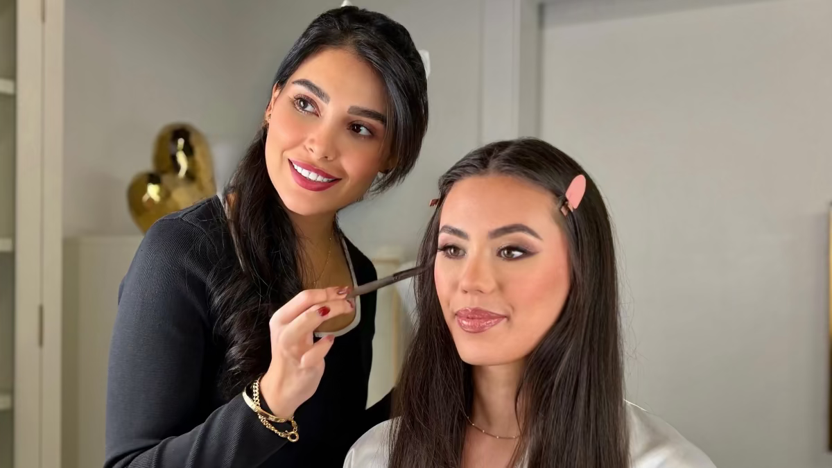 Makeup artist applying makeup at Altitude Salon in Alpharetta. 